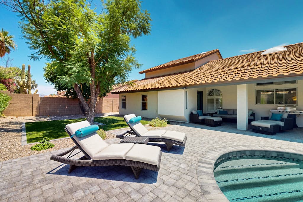 A stately luxury house with pool nestled in a serene neighborhood
