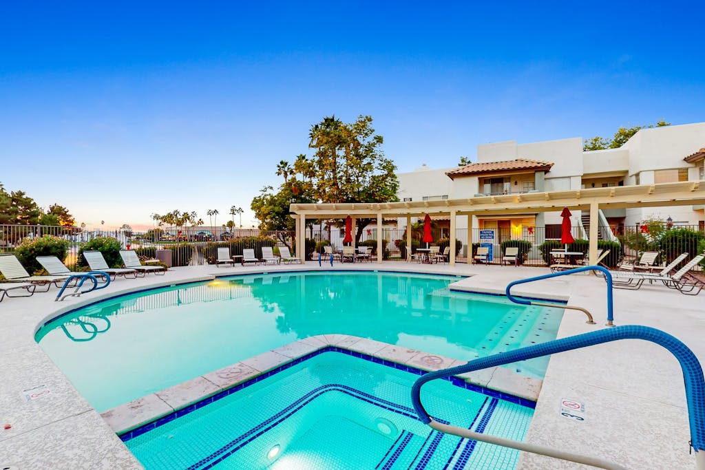 Ground-floor condo with on-site pool, pickleball, hot tub, gym & private balcony