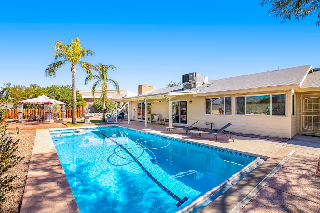 Dog-friendly sunshine stay with private pool, spacious yard, central AC & W/D