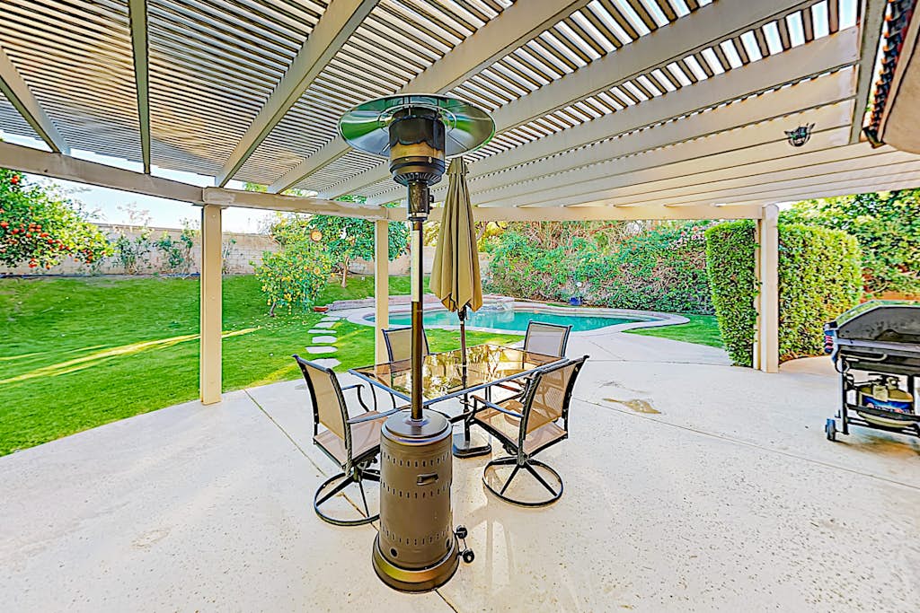 Expansive home with fireplace, heated pool & and spa in backyard haven