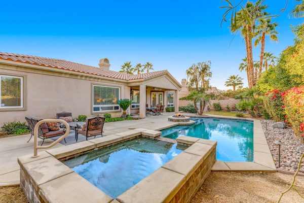 Dog-friendly desert style home with sprawling pool, pool spa, firepit & grill
