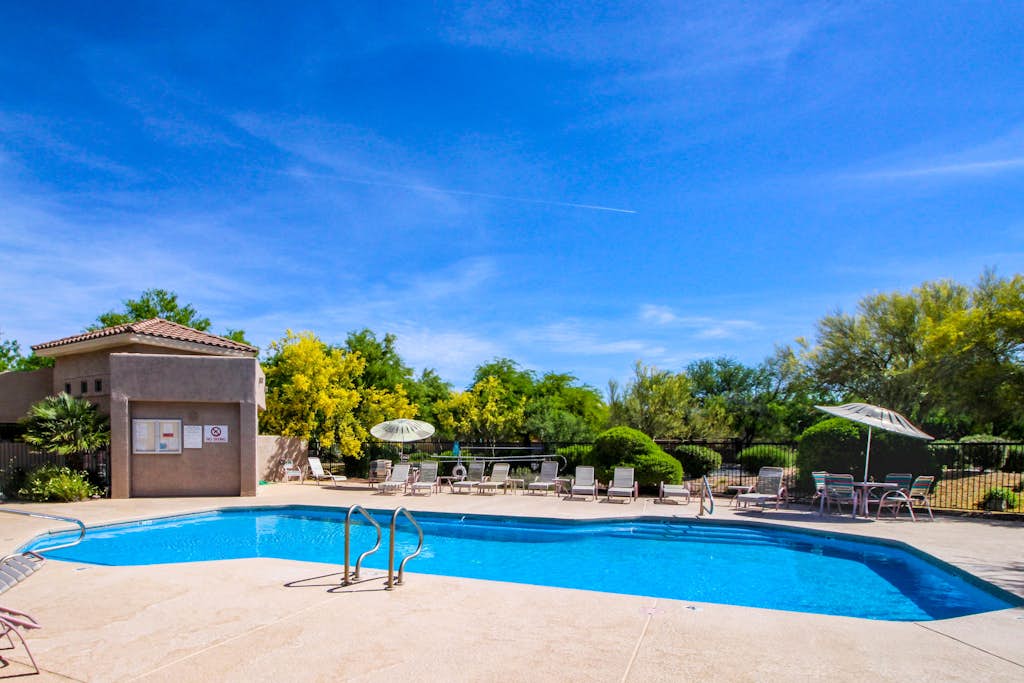 Mountain-view condo with incredible sunset views, pool, hot tub & grill