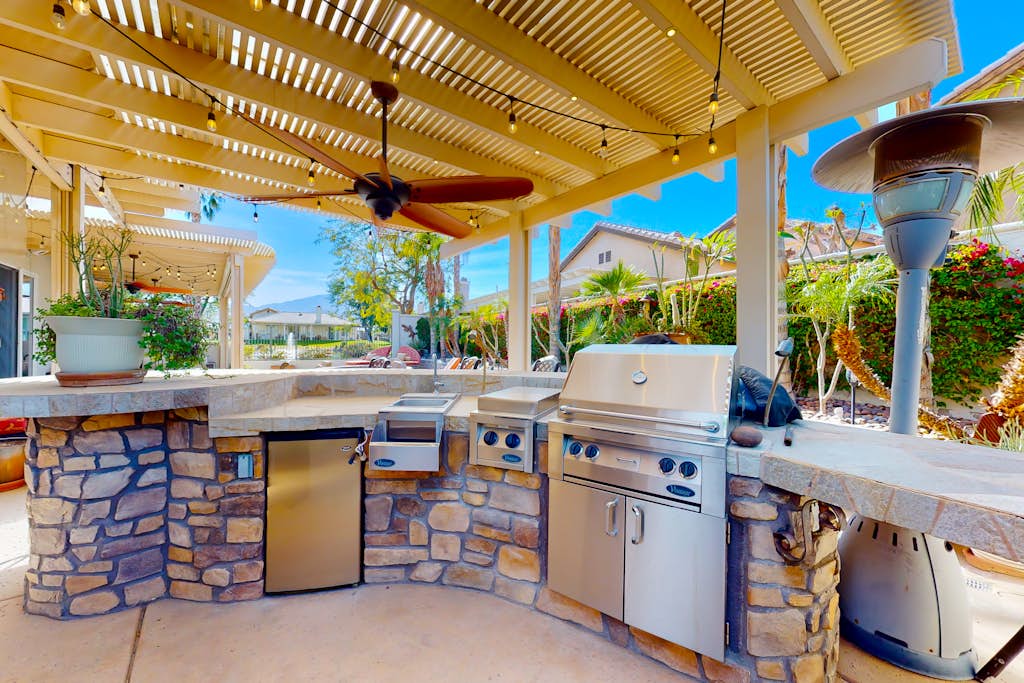 Luxe and spacious retreat with a pool, pool spa, firepit, grill, game room, & AC