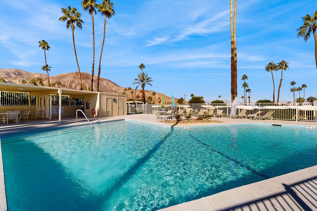 Dog-friendly mountain view condo with pool, grill, open layout, AC, & internet