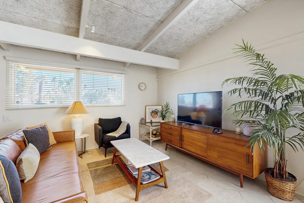 Dog-friendly mountain view condo with pool, grill, open layout, AC, & internet