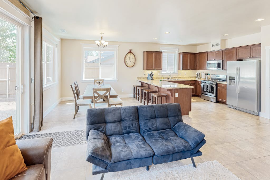 Stylish all-season home with dog-friendly yard, patio, central AC & washer/dryer