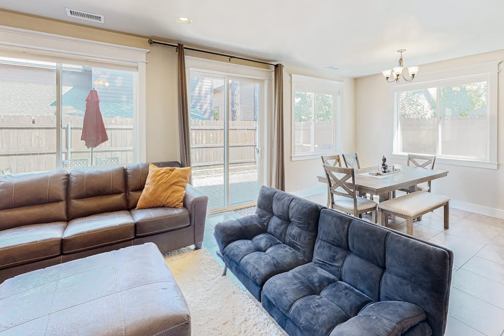 Stylish all-season home with dog-friendly yard, patio, central AC & washer/dryer