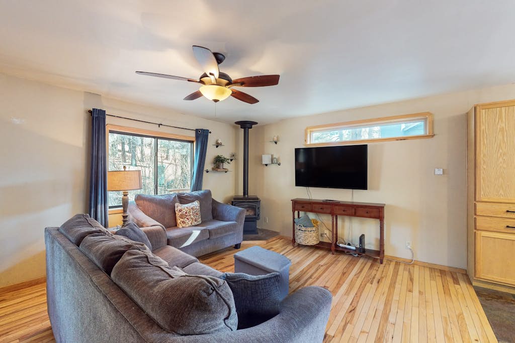 Two-story home with sunroom, large yard, fire pit, & BBQ grill