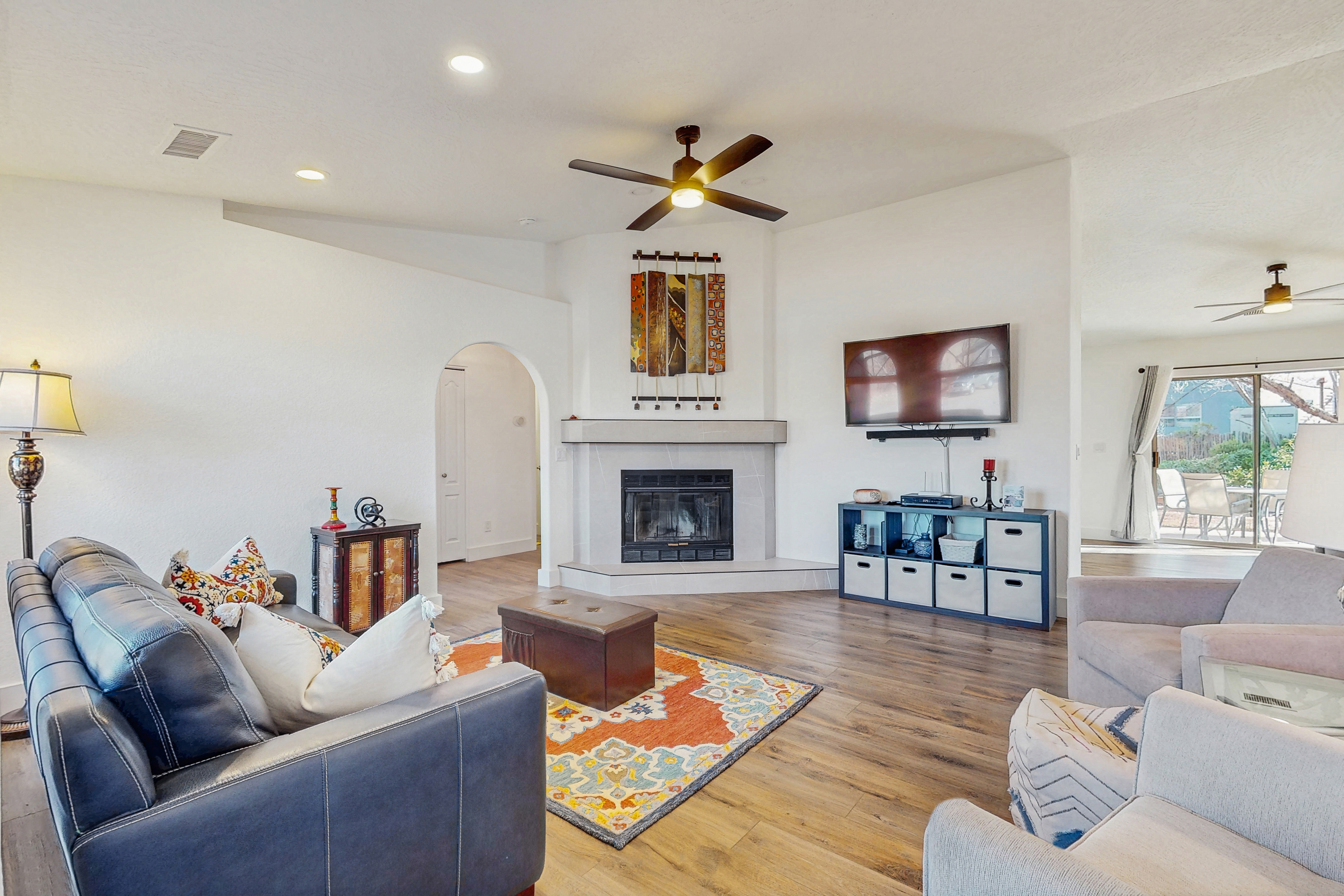 Dog-friendly home with garden patio, fireplace, & views of red rock cliffs