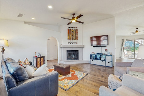 Dog-friendly home with garden patio, fireplace, & views of red rock cliffs