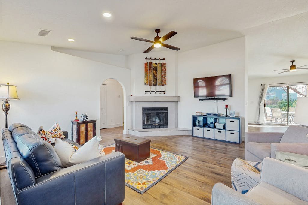 Dog-friendly home with garden patio, fireplace, & views of red rock cliffs