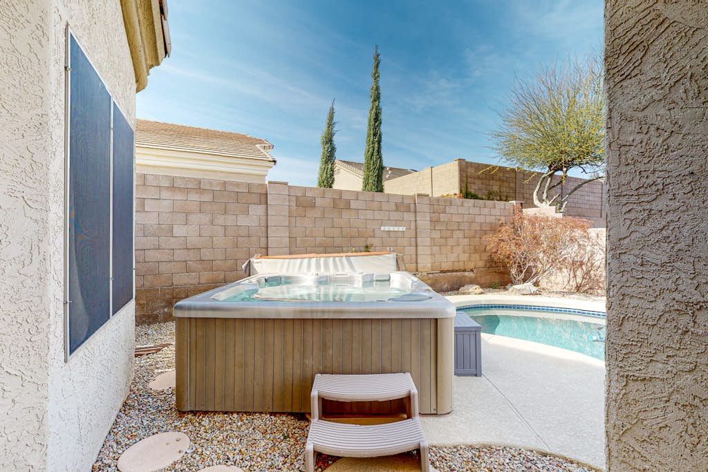 Inviting home with pool, hot tub, enclosed yard, fast WiFi, & W/D