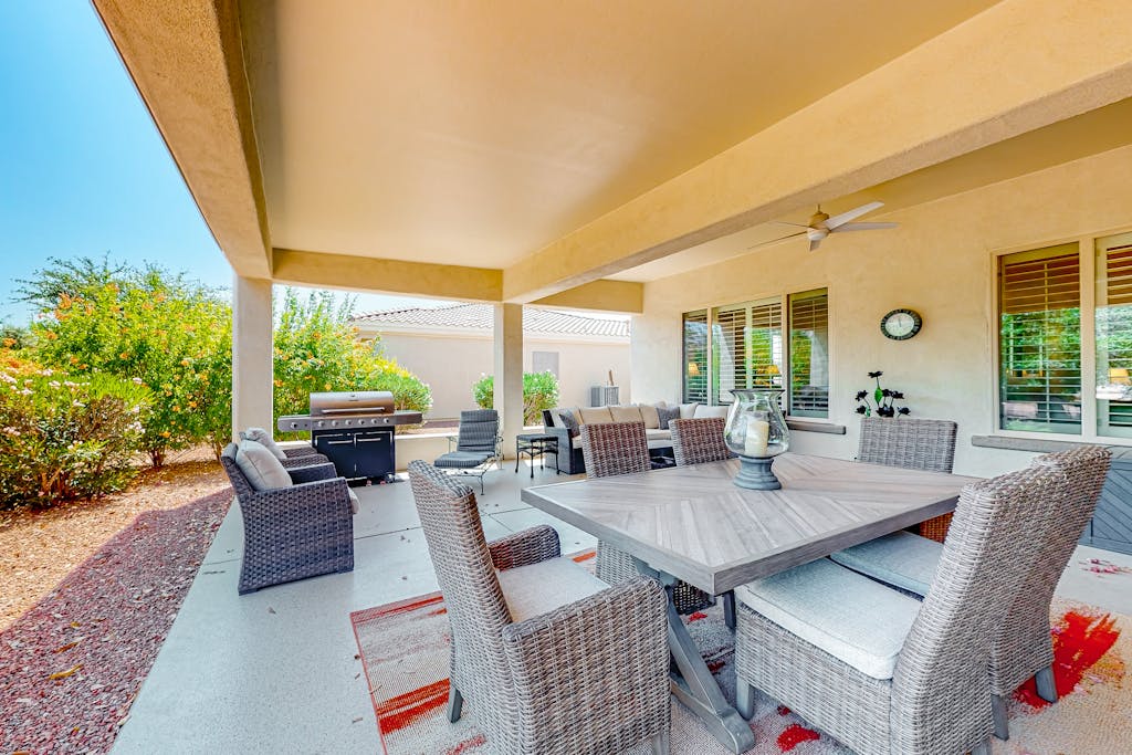 Amazing home with fitness room, tennis court, hot tub, pool, kitchen, & patio