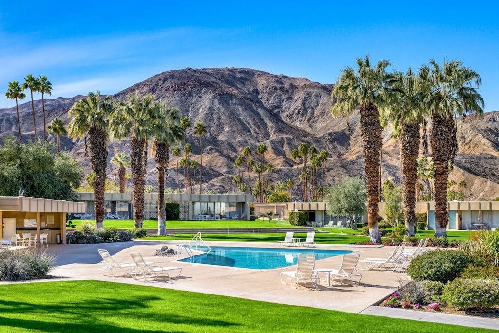 Iconic mid-century modern home with on-site pool access, grill, AC, & W/D