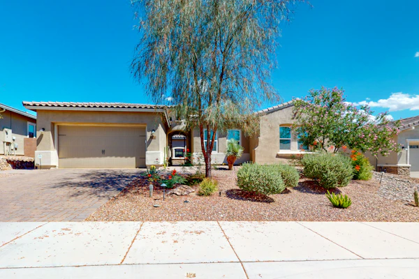 Southwestern stunner with enclosed yard, pool, putting green, & grill