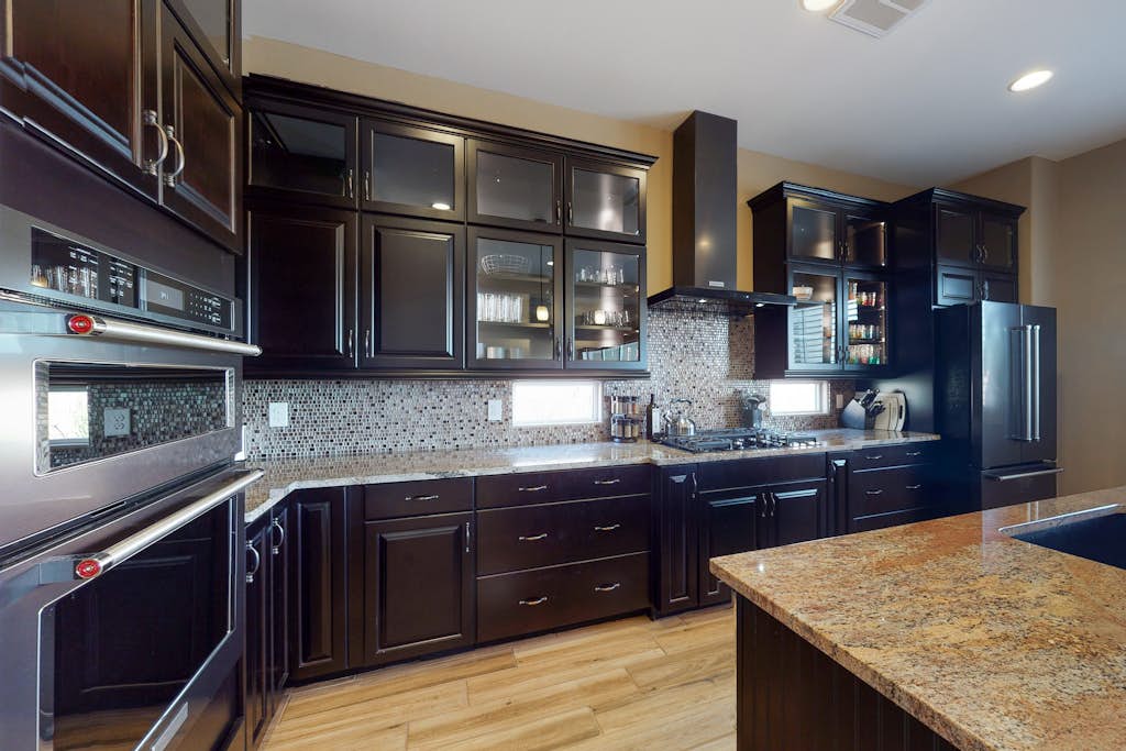 Southwestern stunner with enclosed yard, pool, putting green, & grill