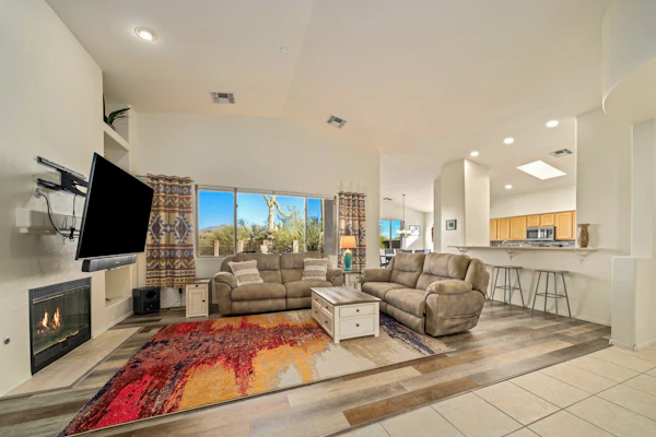 Remodeled modern beauty backs to open desert with mountain views & home theatre