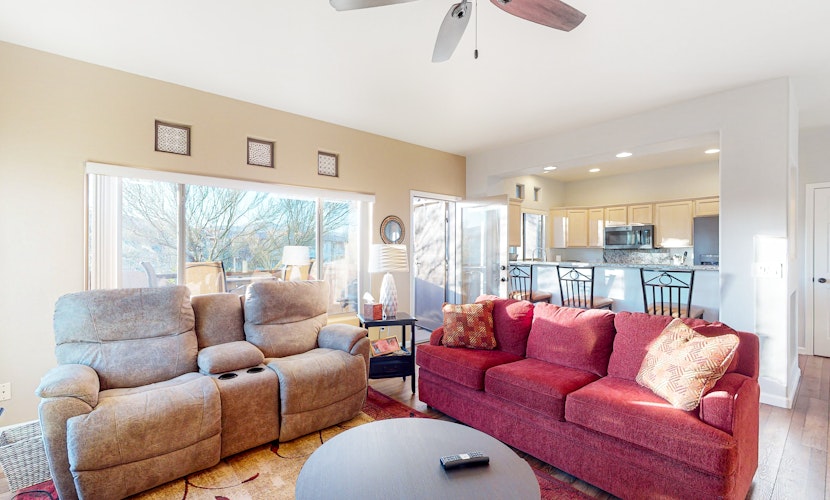 Sunny, dog-friendly condo with a heated pool, gym, grilling area, & golf nearby