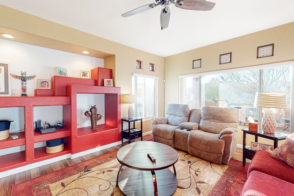 Sunny, dog-friendly condo with a heated pool, gym, grilling area, & golf nearby