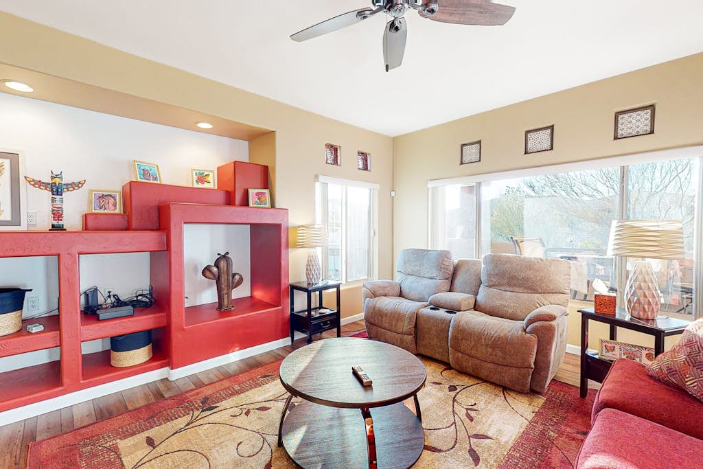 Sunny, dog-friendly condo with a heated pool, gym, grilling area, & golf nearby