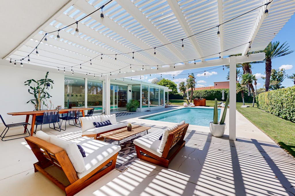 Mid-century golf course-front home with private pool, golf/mtn views, fireplace