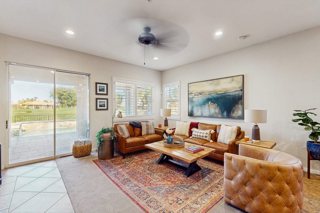 Dog-friendly golf course-adjacent home with a private pool, pool spa, & AC