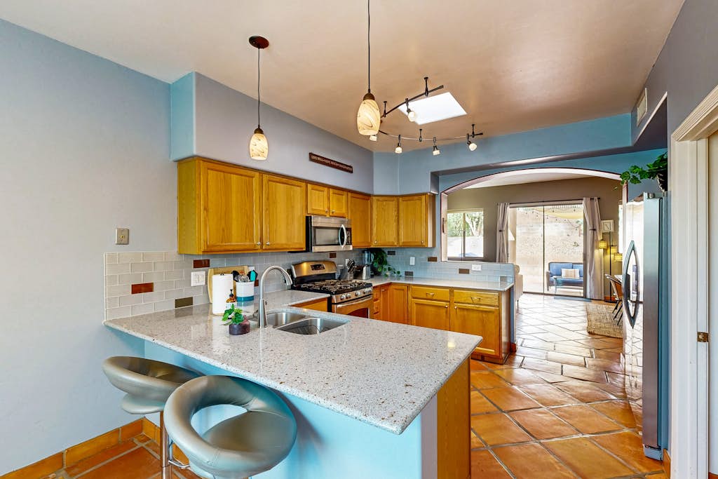 Dog Friendly home with hot tub, large yard, grill, & gas fireplace!