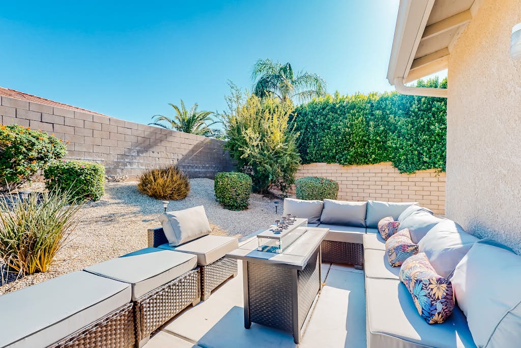 Dog-friendly home with patio, grill, firepit, outdoor pool, tennis, & fireplace