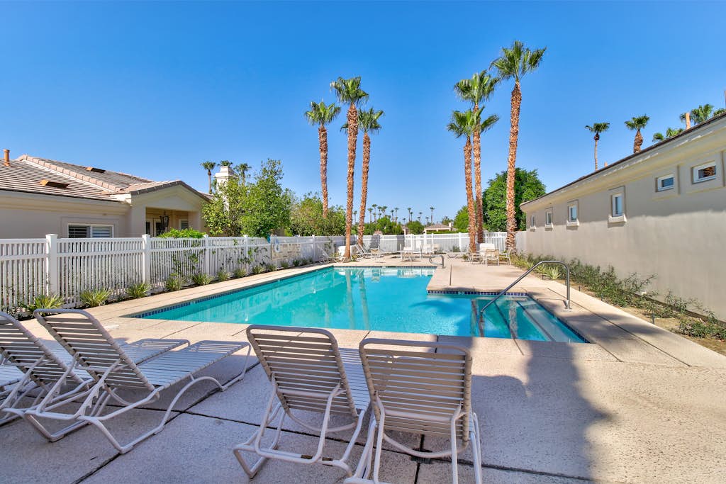 PGA West course-side house with shared pool, hot tub, and golf access