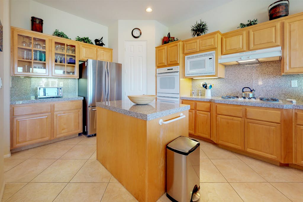 PGA West course-side house with shared pool, hot tub, and golf access
