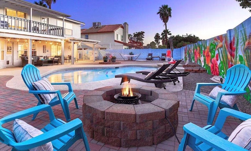 Fun-filled, modern home with game room, heated pool, hot tub, grill