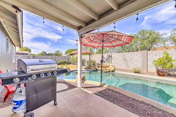 Single-level dog-friendly home with private pool, grill, enclosed backyard, & AC