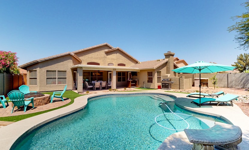 Dog-friendly home with pool, grill, office, enclosed backyard, & fireplace