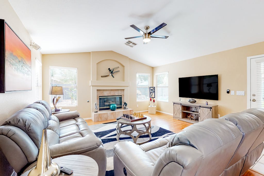 Dog-friendly home with pool, grill, office, enclosed backyard, & fireplace