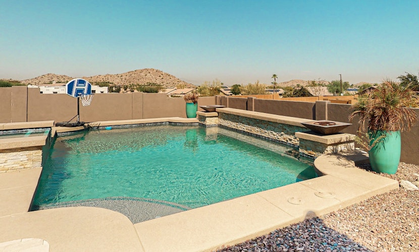 Luxury home with a pool, spa, fireplace, & private gas grill