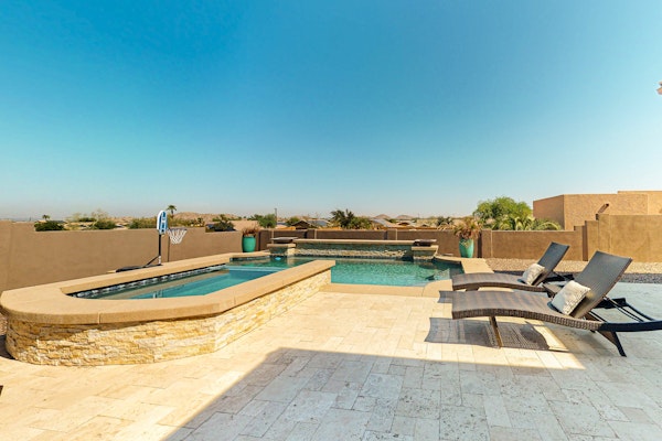 Luxury home with a pool, spa, fireplace, & private gas grill