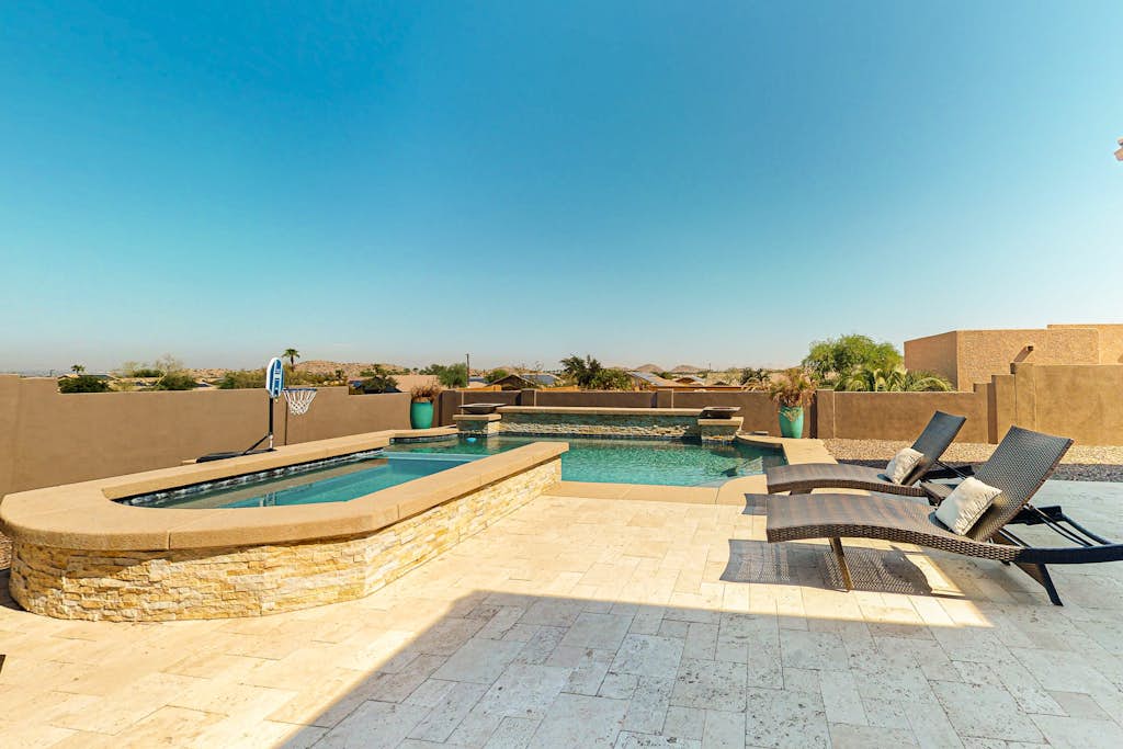 Luxury home with a pool, spa, fireplace, & private gas grill