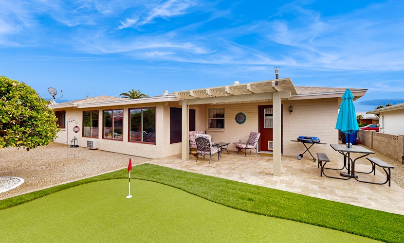 Sunny home with covered patio, grill, pool, tennis, hot tub, full kitchen, & AC