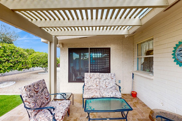 Sunny home with covered patio, grill, pool, tennis, hot tub, full kitchen, & AC