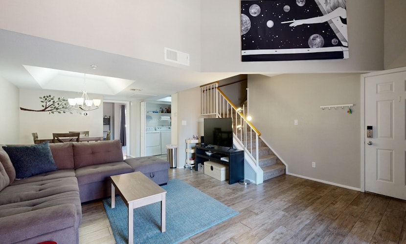 Inviting desert oasis with modern decor, pool, and hot tub