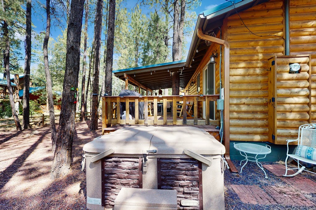 Tranquil forest cabin with private hot tub, firepit, play area, enclosed yard