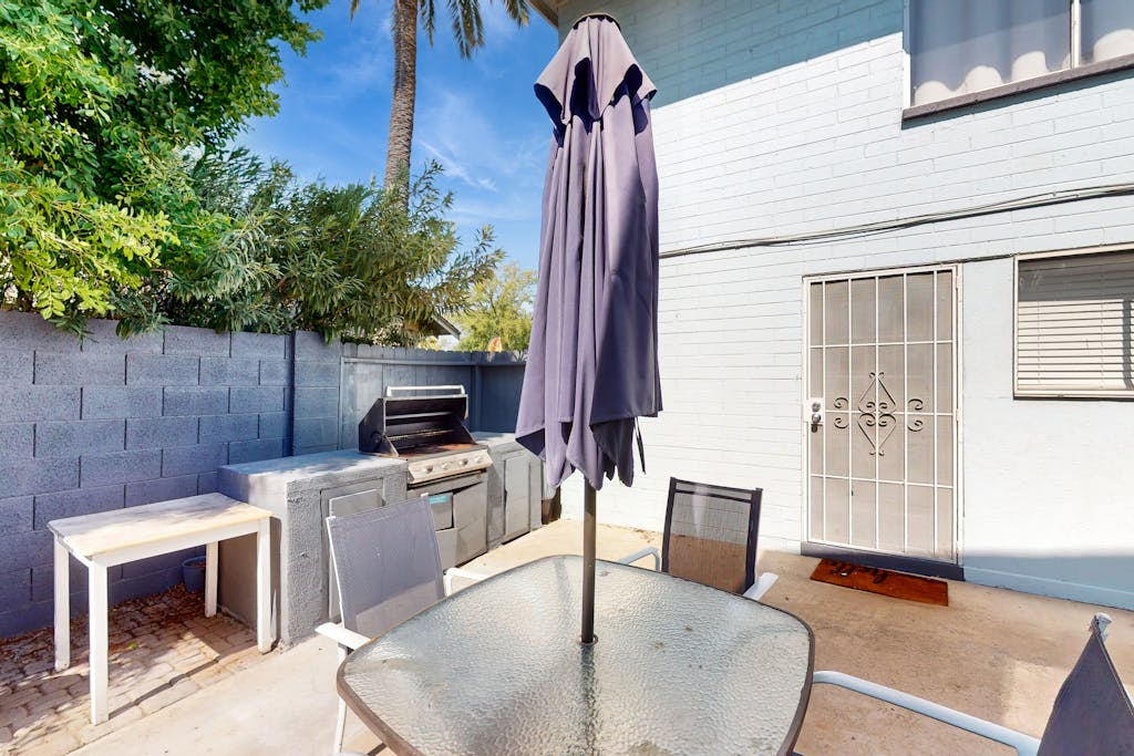 Dog-friendly condo near attractions with fenced yard, central AC, and cute decor