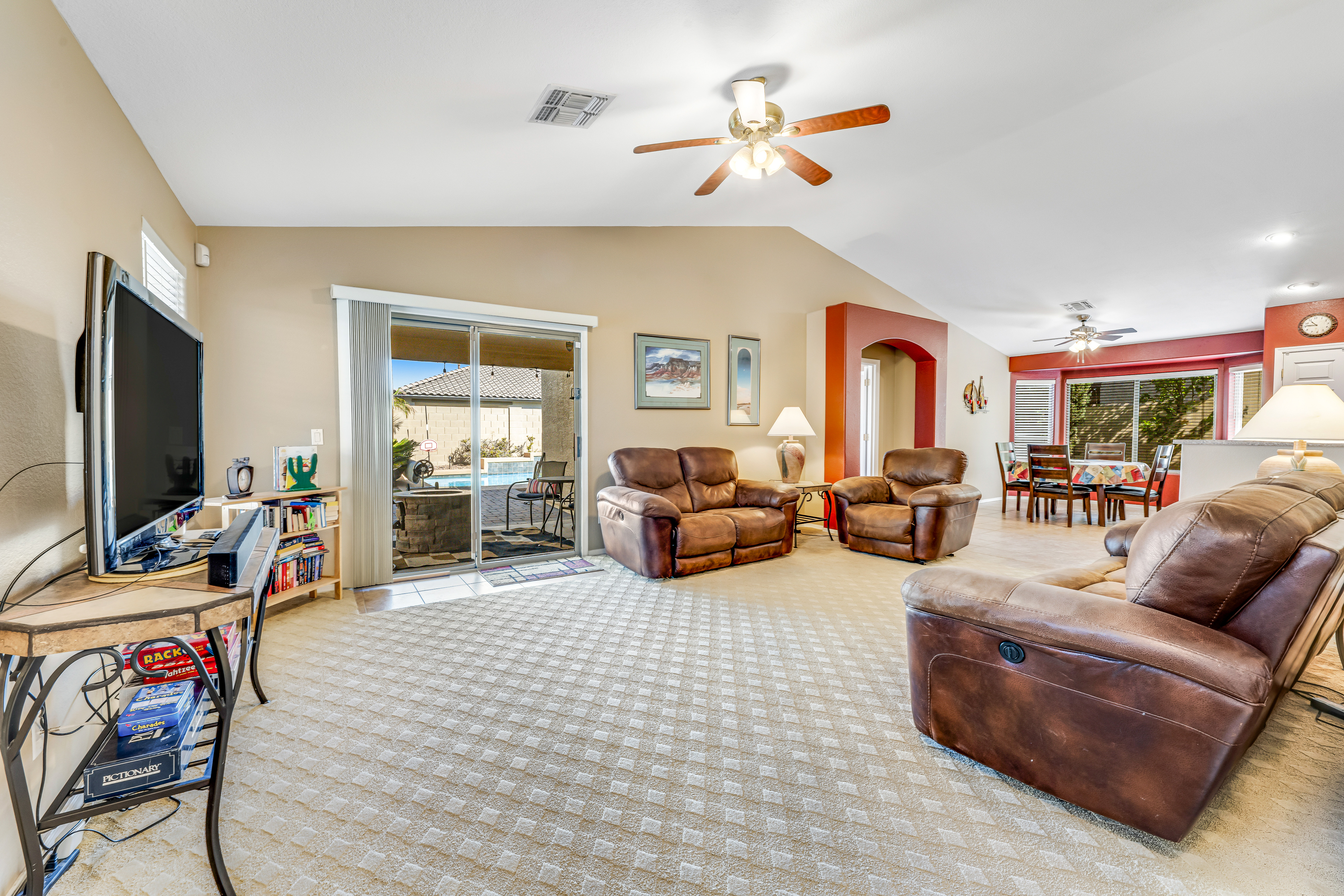 Spacious home with private heated pool with waterfall, putting green & firepit