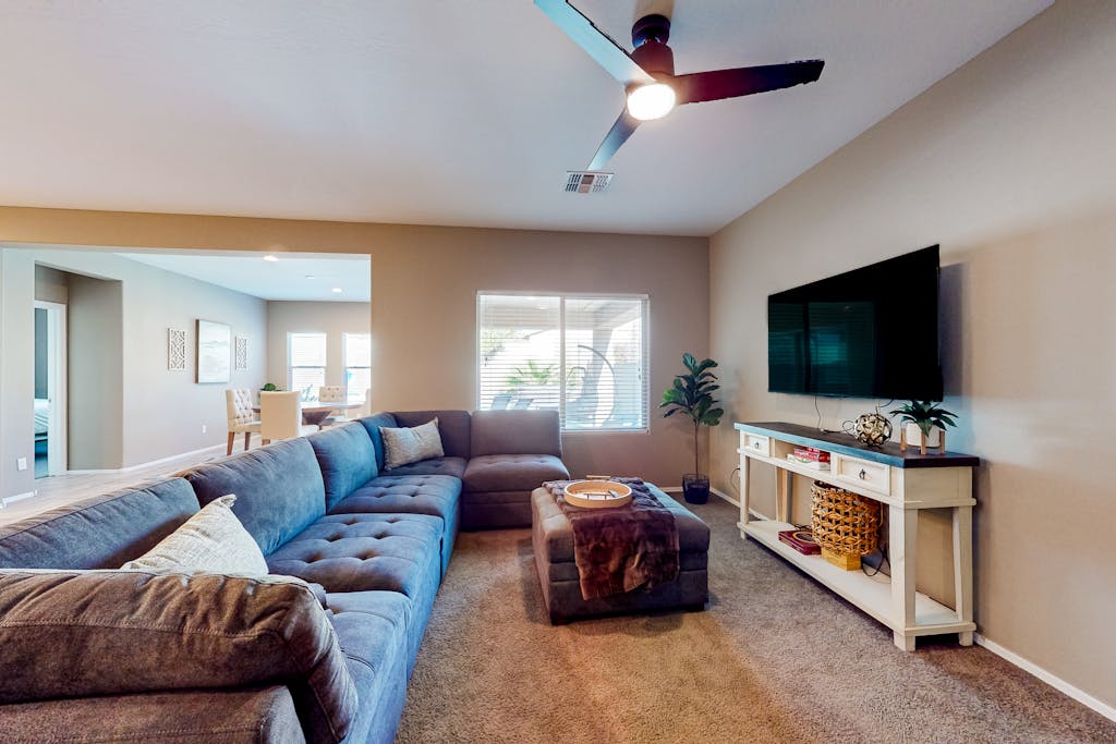 Single-story home with enclosed yard, private pool, hot tub, patio, & grill