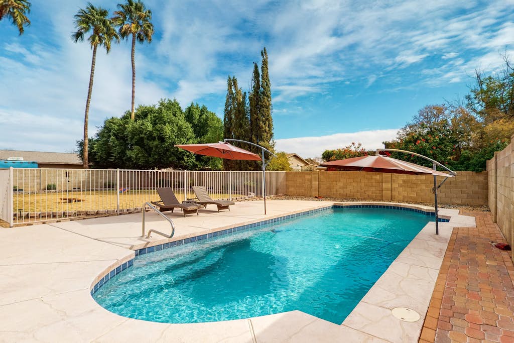 Welcoming home with private outdoor pool, pool table, patio, grill & central AC