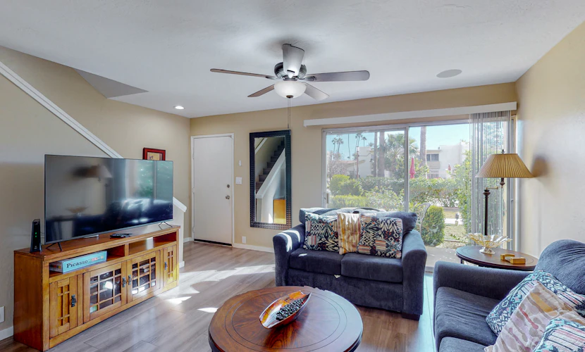 Sun-filled condo with a patio, central AC, pool & grill access - great location