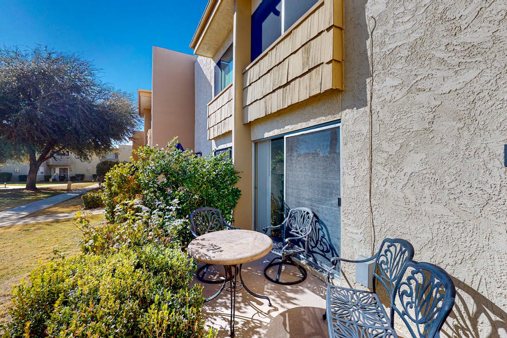 Sun-filled condo with a patio, central AC, pool & grill access - great location