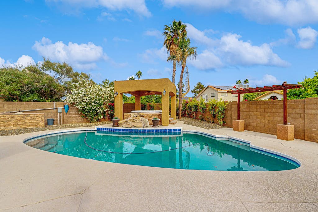 Scottsdale Style Meets Family-Friendly Fun! Spacious home with a yard and pool.