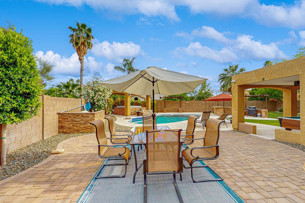 Scottsdale Style Meets Family-Friendly Fun! Spacious home with a yard and pool.