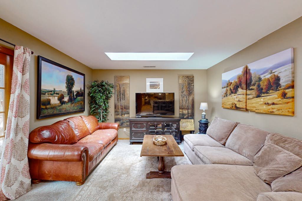 Lavish retreat with game room, tranquil porch & scenic yard-near skiing & dining